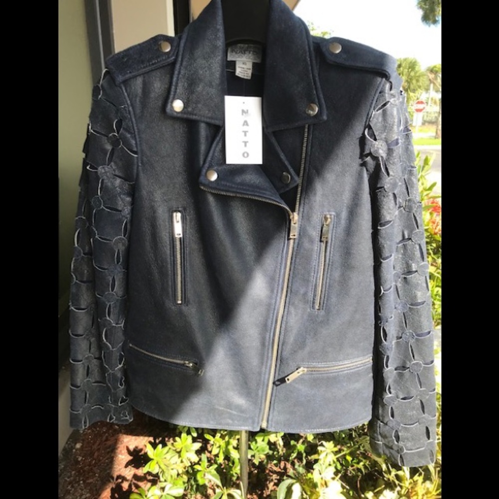 Handcrafted biker jacket in distressed black leather.